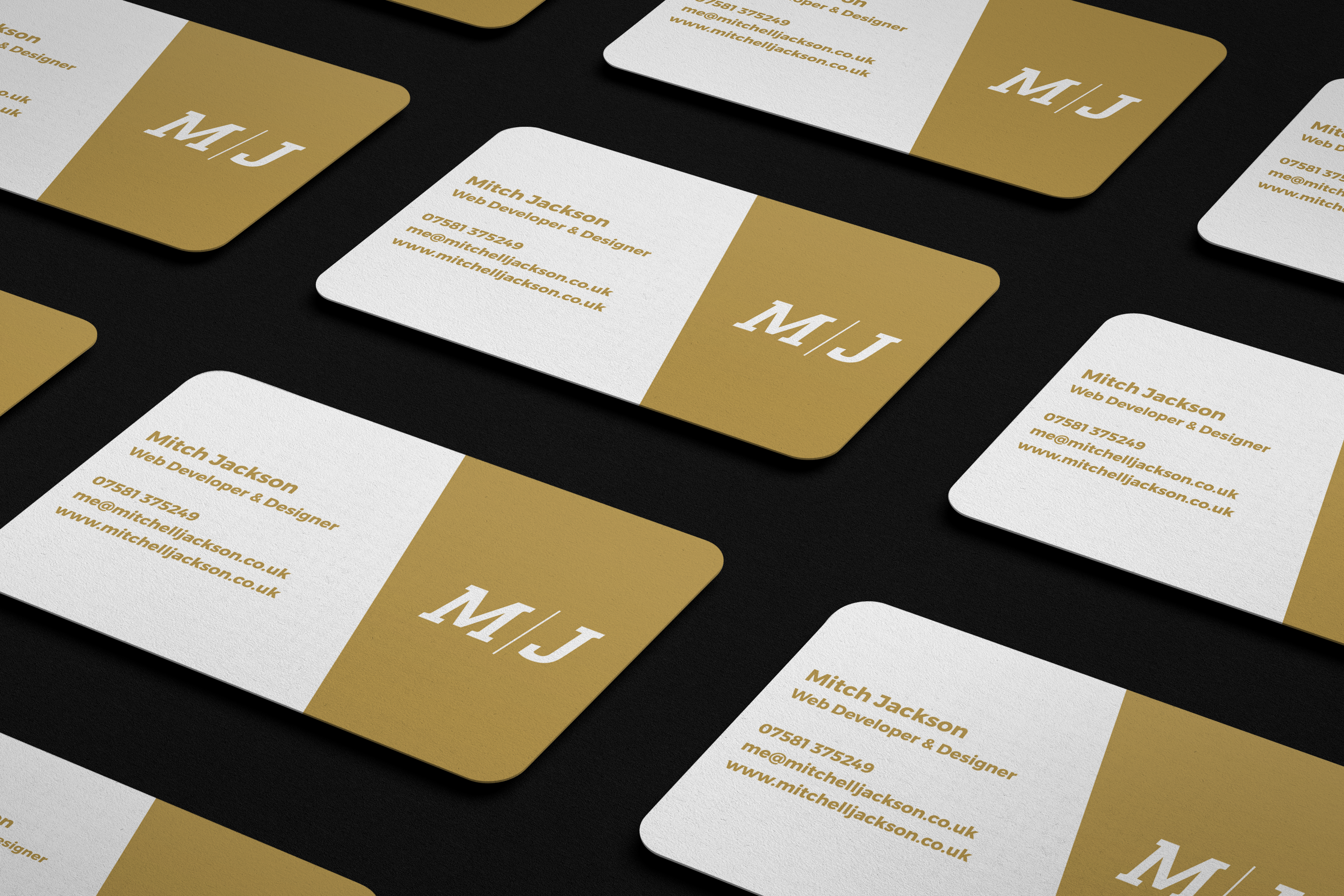 M/J business cards in rows on desk